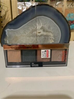 Revlon eyeshadow palette in beige, green, and rose gold tones